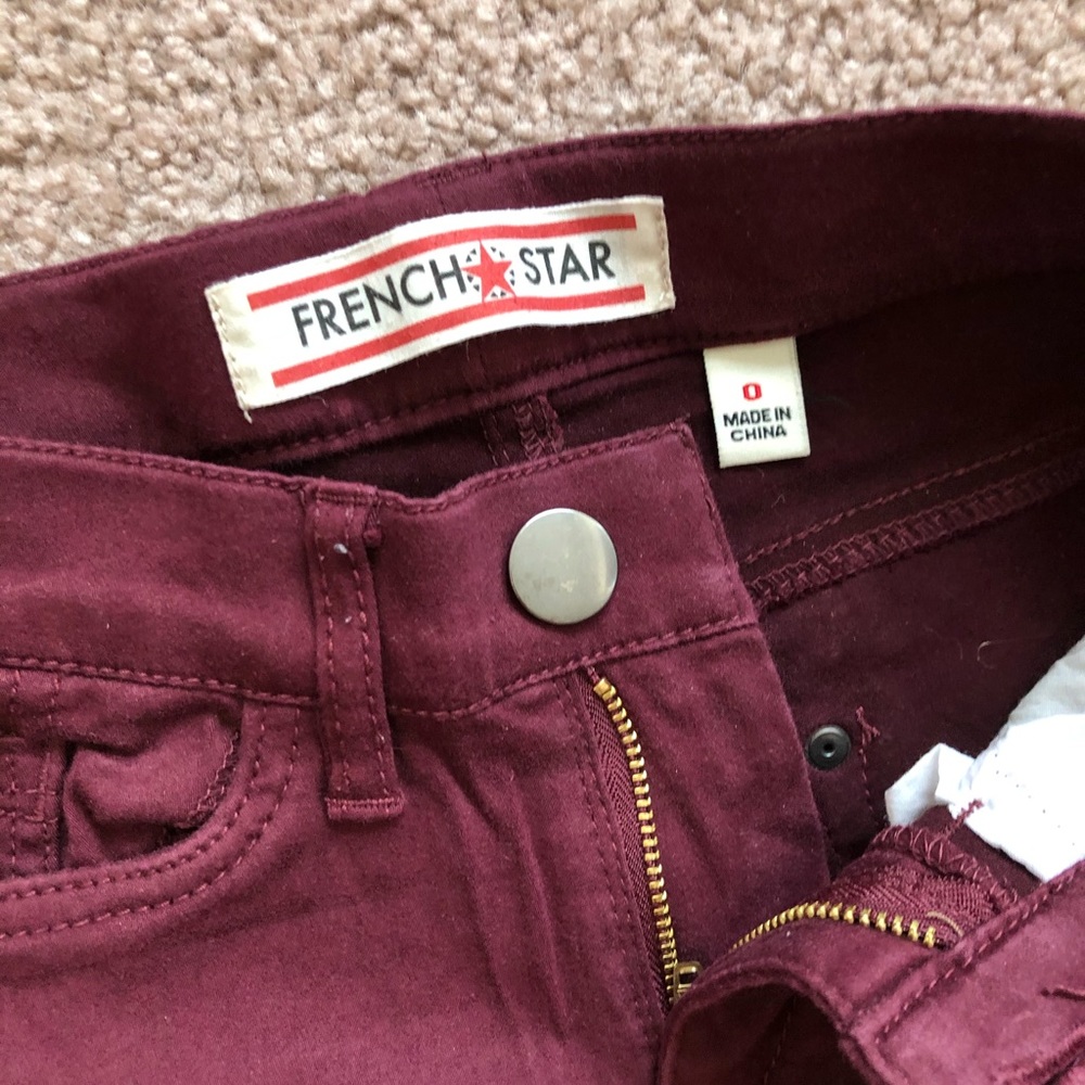 Burgundy French star skinny jeans